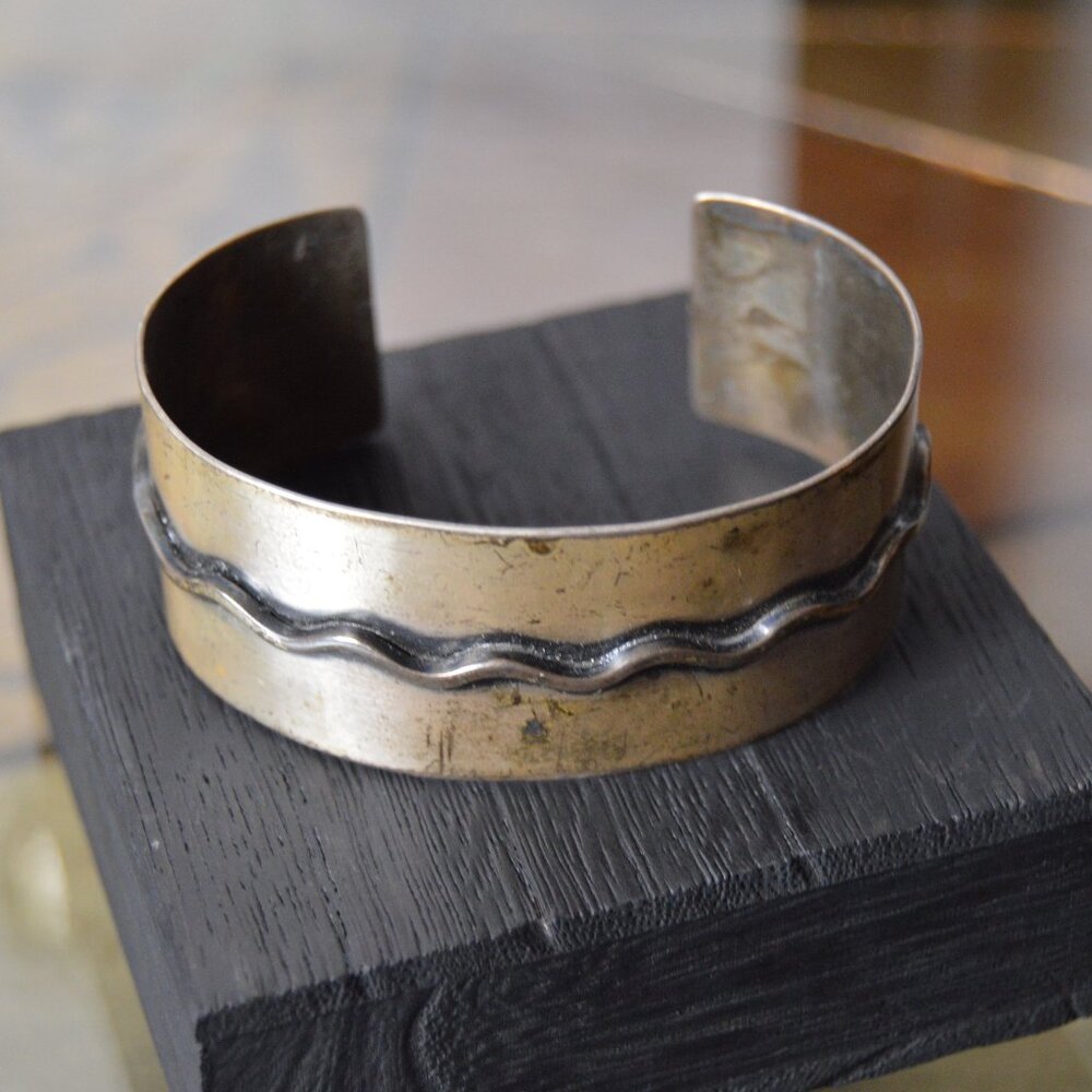 Vintage sterling silver cuff bracelet with wave design, by Otto Robert Wade